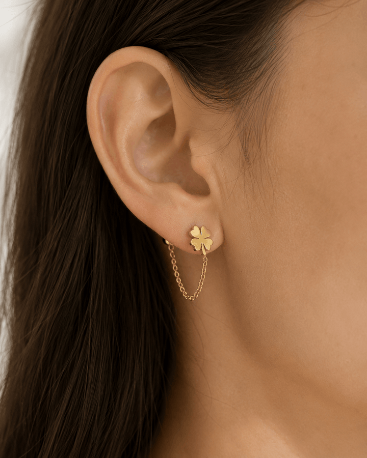 Clover chain earrings worn on the ear