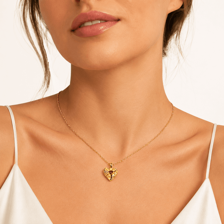 Heart pendant necklace worn at the neckline
